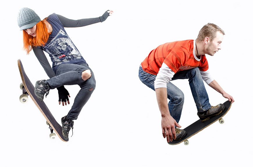 Two Skateboarders Performing Aerial Tricks On White Background