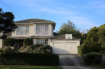 Suburban two-story house with garage and garden