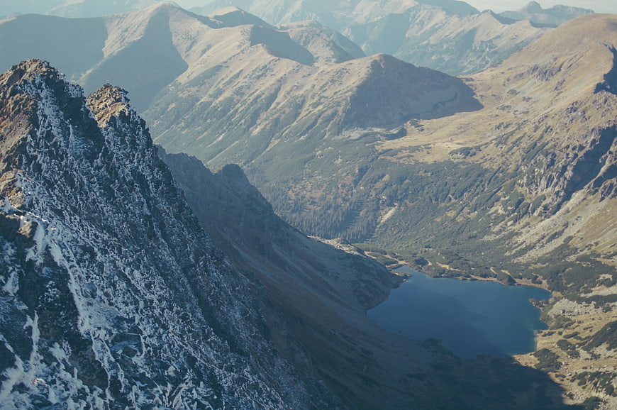 Snowy Mountain Peak Overlooking Alpine Lake Valley
