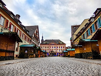 Cobblestone Street with Christmas Market Stalls in European Town Square