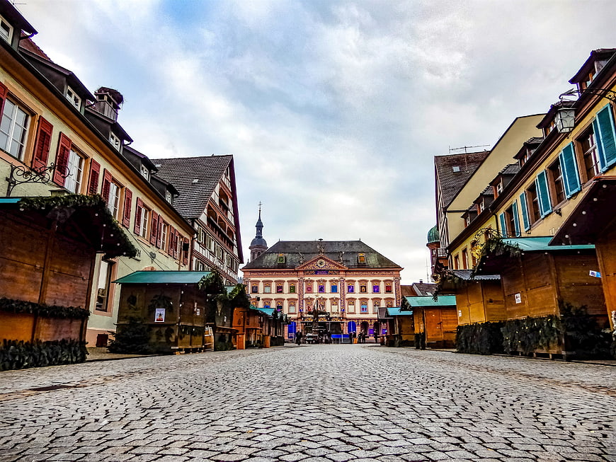 Cobblestone Street with Christmas Market Stalls in European Town Square