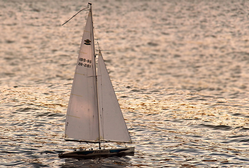 Remote Control Sailboat on Golden Sunset Water