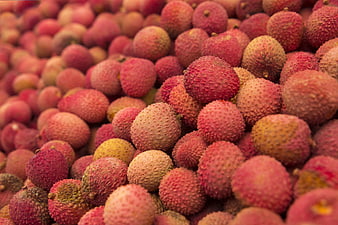 Close-up of fresh red lychee fruit pile