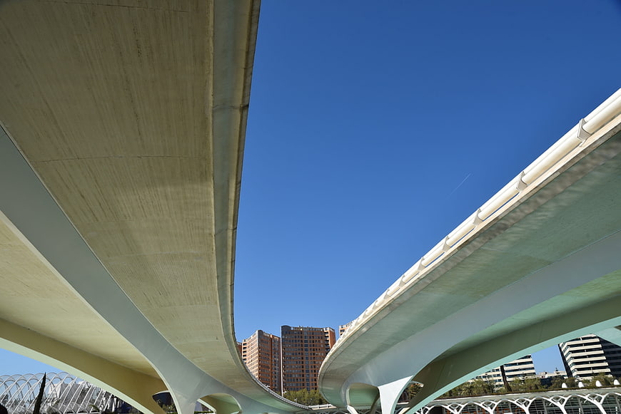 Low angle view of modern concrete highway overpasses against blue sky