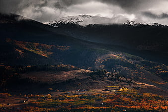 Dramatic Autumn Mountain Landscape with Snow-Capped Peak