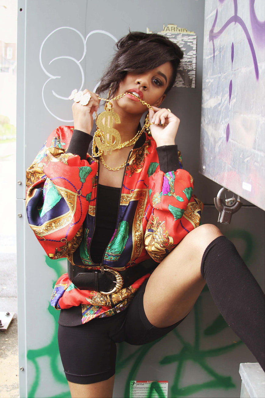 Stylish Woman in Colorful Jacket with Gold Chain