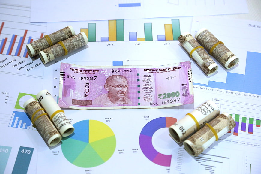 Indian 2000 Rupee Note And Cash Rolls On Financial Charts