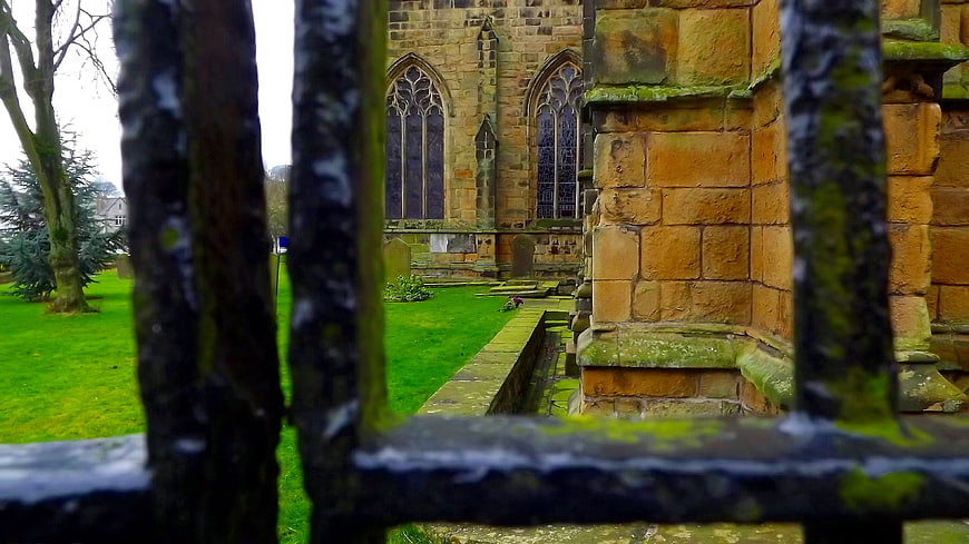 Old Stone Church Viewed Through Iron Fence