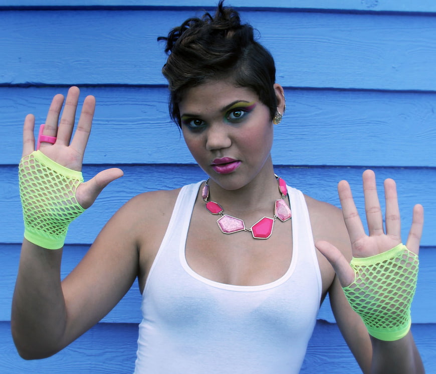 Woman in 80s Neon Fashion Style with Mesh Gloves