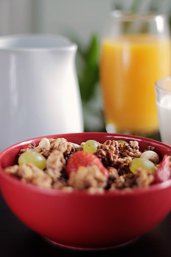 Healthy Breakfast Granola Bowl with Fresh Fruit and Orange Juice