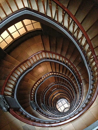 Top-down view of a wooden spiral staircase