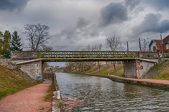 Green metal bridge over Roanne-Digoin canal in France