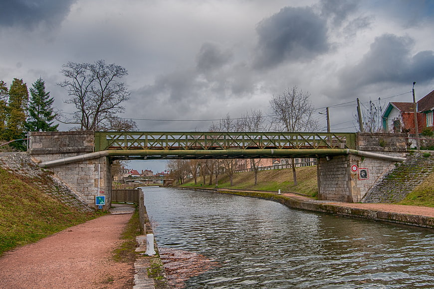 Green metal bridge over Roanne-Digoin canal in France