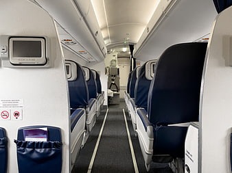 Empty Economy Class Airplane Cabin Interior Aisle