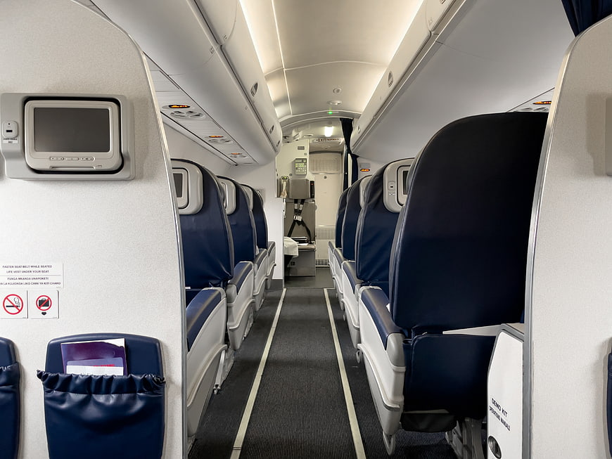 Empty Economy Class Airplane Cabin Interior Aisle