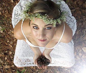 Woman in White Lace Dress with Flower Crown in Forest