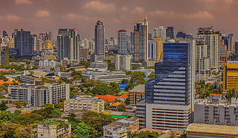 Bangkok City Skyline Panorama With Skyscrapers And Dramatic Clouds