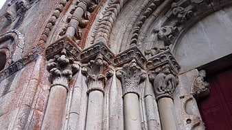 Romanesque church portal with carved stone capitals
