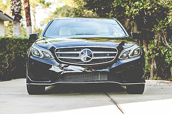Front view of black luxury Mercedes-Benz sedan parked outdoors