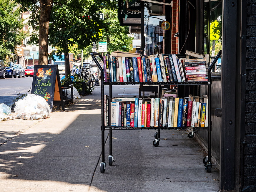 Outdoor Bookshelf Display on City Sidewalk