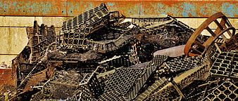 Pile of rusted scrap metal and industrial waste in junkyard