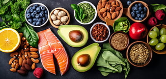 Top View of Healthy Foods: Salmon, Avocado, Nuts, and Berries