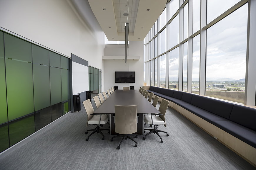 Modern Conference Room With Floor-To-Ceiling Windows And Long Table