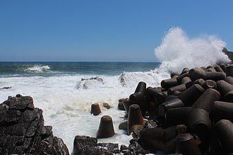 Powerful Ocean Waves Crashing Against Concrete Tetrapods