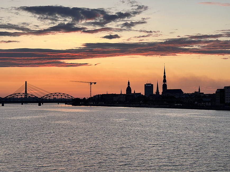 Riga Skyline at Sunset with Vanšu Bridge and Church Spires