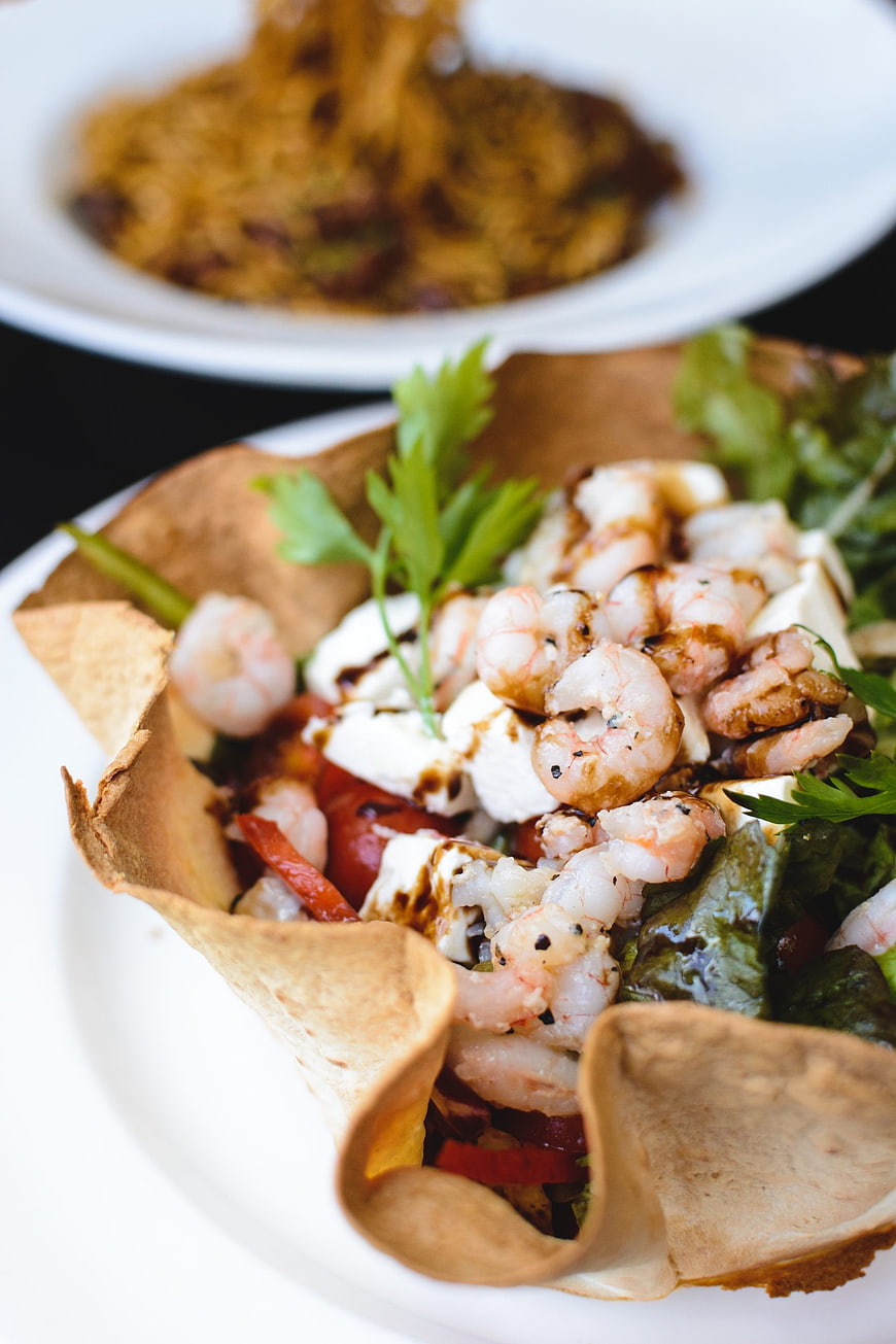 Gourmet shrimp salad in crispy pita cone with feta cheese