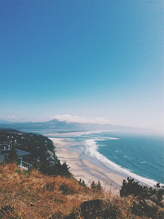 High Angle Coastal Landscape with Sandy Beach and Blue Ocean