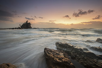 Long Exposure Sunset Over Rocky Ocean Coastline