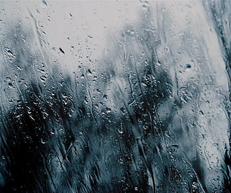 Abstract Blue Rain Droplets on Glass Texture Background