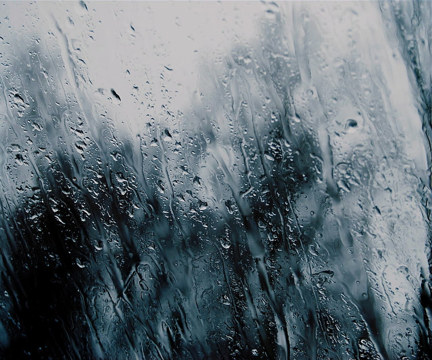 Abstract Blue Rain Droplets on Glass Texture Background