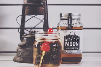 Midnight Moon Apple Pie Moonshine with Cocktail in Mason Jar