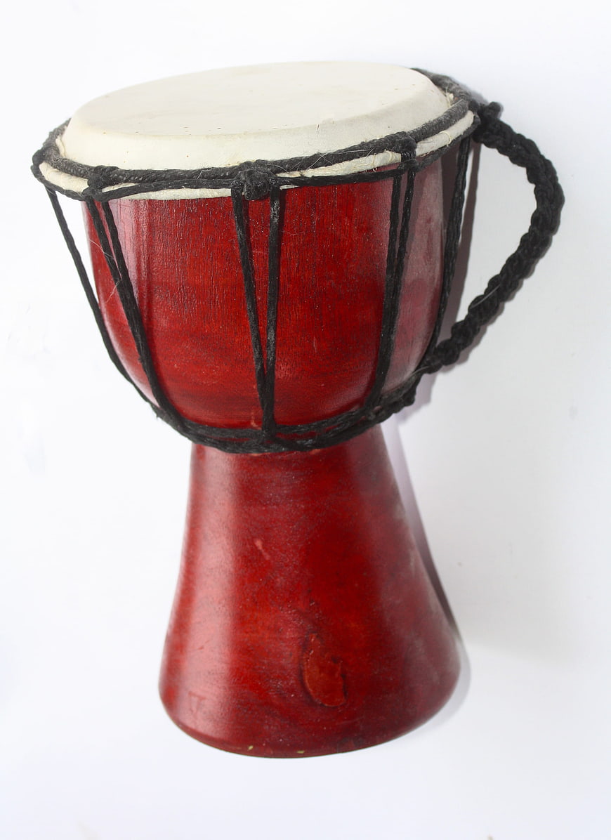 Red djembe drum isolated on white background
