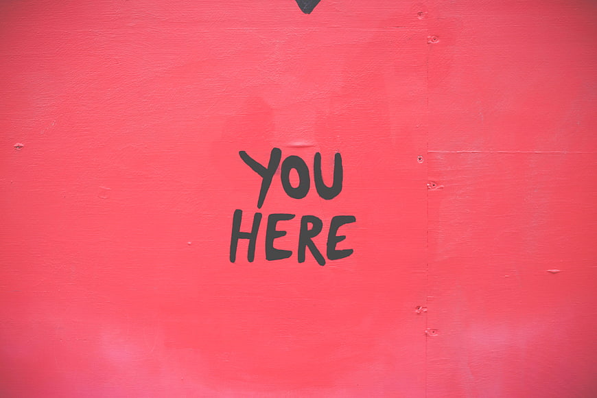 You Here Graffiti on Red Wall