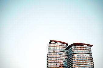 Modern curved skyscrapers against a clear blue sky