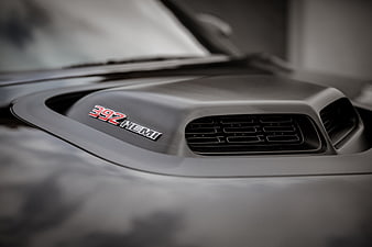 Close-up of black car hood scoop with 392 Hemi badge