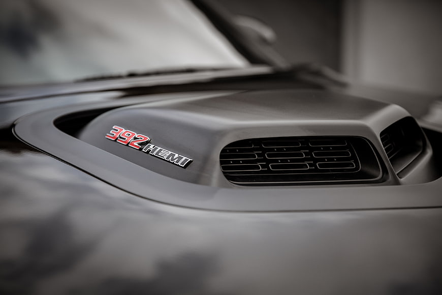 Close-up of black car hood scoop with 392 Hemi badge