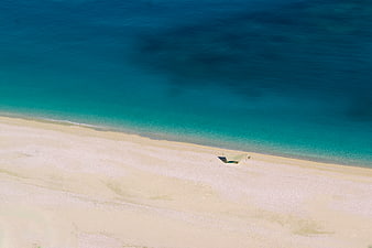 Aerial View of Turquoise Sea and White Sandy Beach
