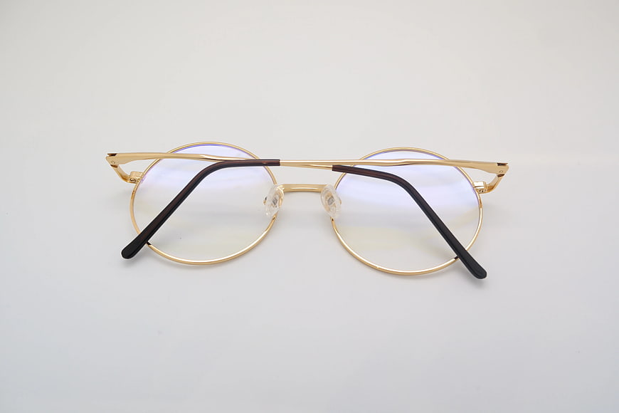 Gold Round Eyeglasses on White Background