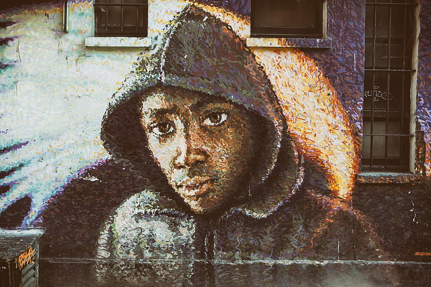 Street Art Portrait of Hooded Figure on Urban Wall
