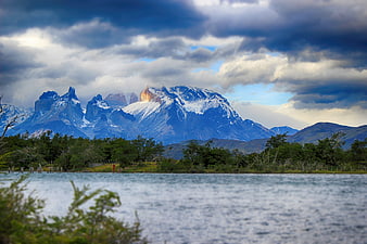 Dramatic Torres del Paine Mountains with Lake and Clouds