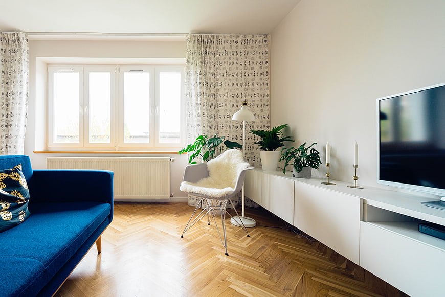 Modern Living Room with Blue Sofa and Herringbone Floor