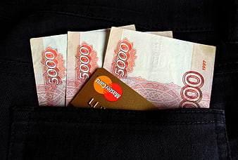 Russian Rubles and Mastercard in Black Jeans Pocket
