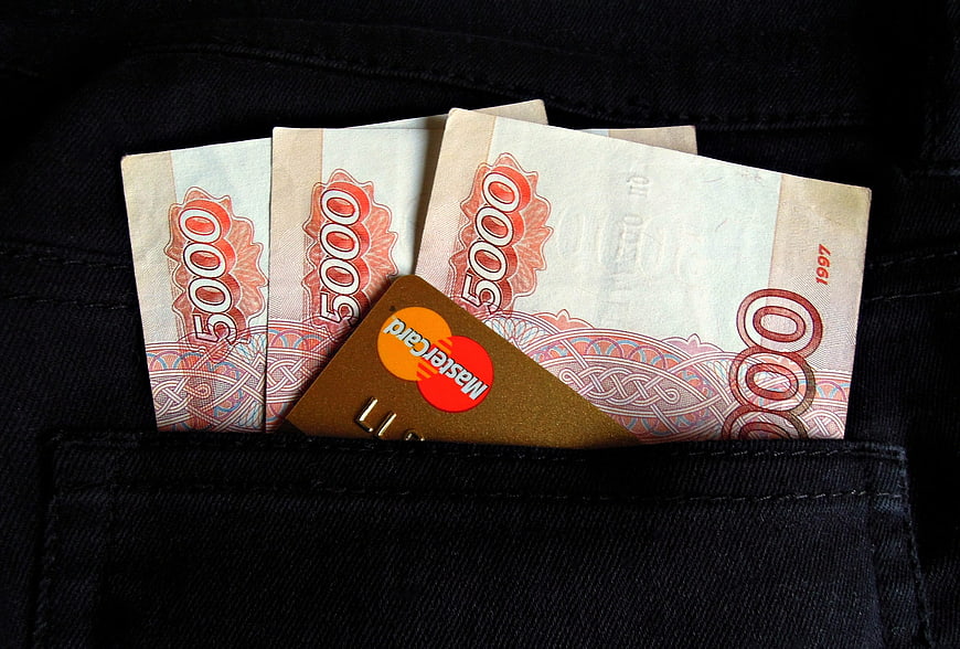 Russian Rubles and Mastercard in Black Jeans Pocket