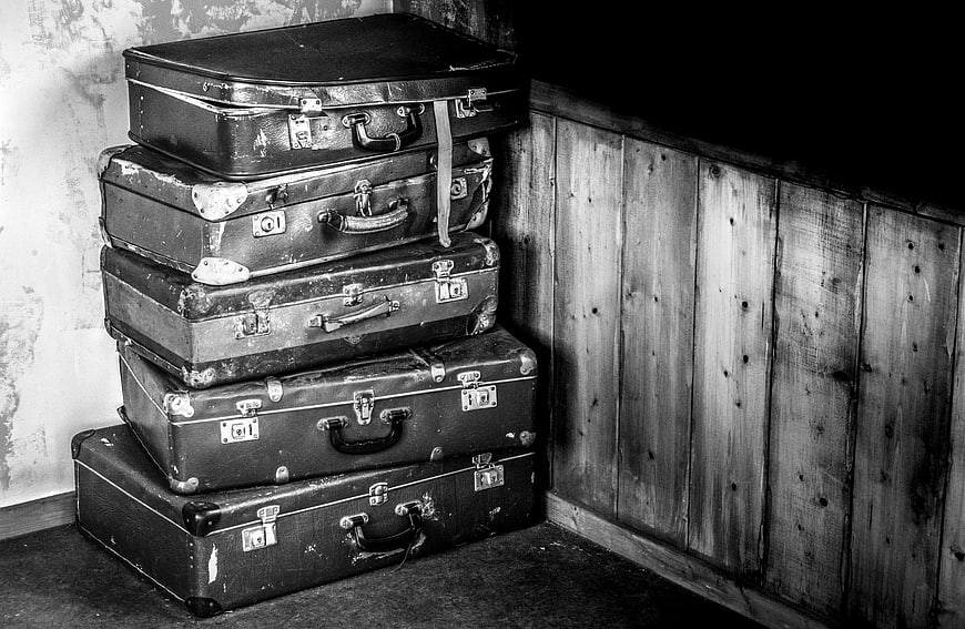Stack of vintage suitcases in black and white