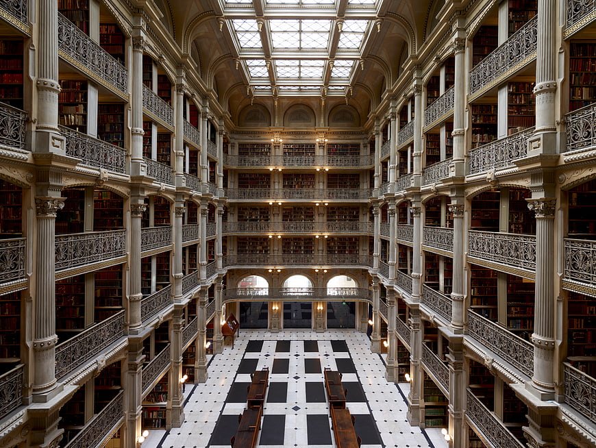 Grand historic library interior with skylight and bookshelves