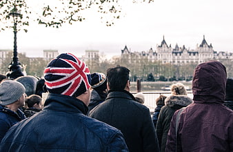 Man wearing Union Jack beanie in London crowd
